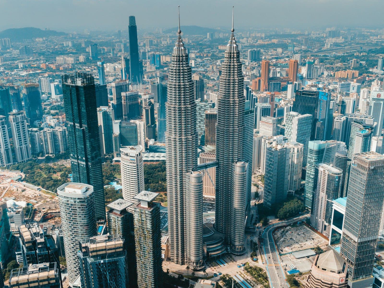 Aerial view of Kuala Lumpur with the Petronas Twin Towers among skyscrapers