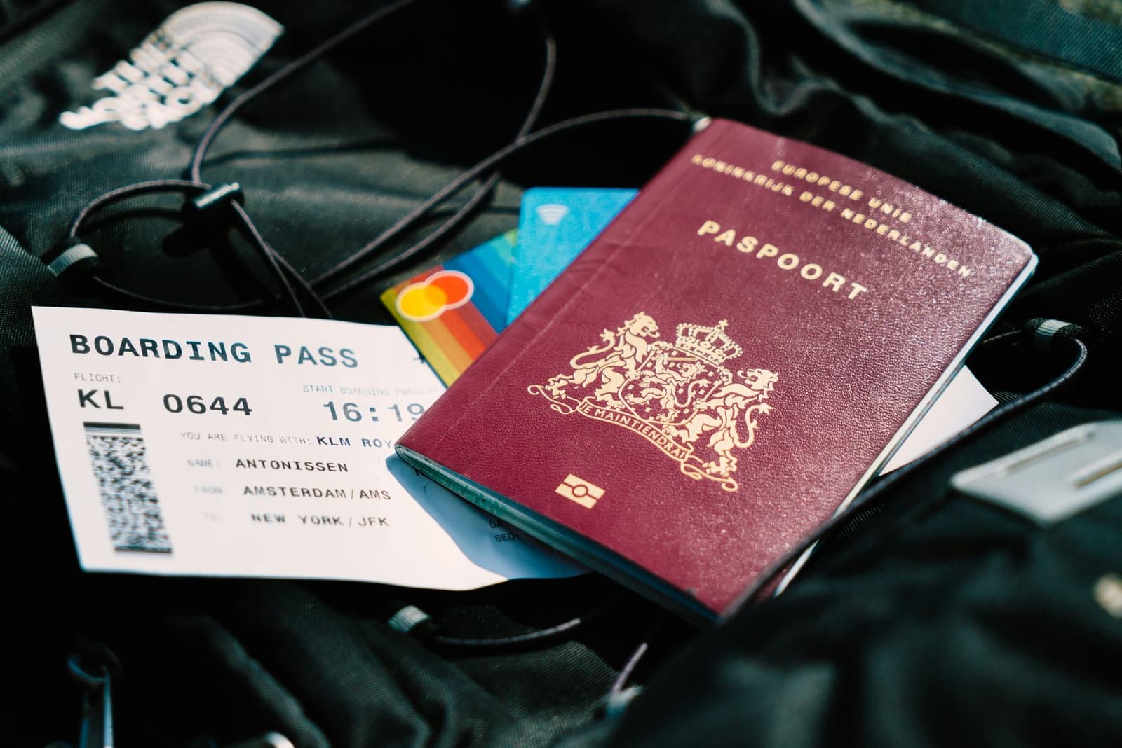 A passport resting on a boarding pass